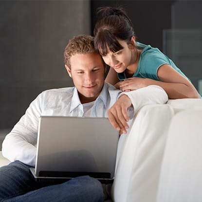 Schedule Online at Zen'd Out Process, Denver A man and a woman looking at a laptop together