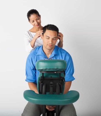 In-Office Chair Massage at Zen'd Out Massage A man getting an in-office chair massage.