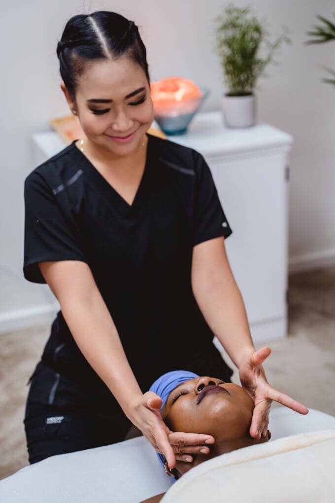 Full Body Massage at Zen'd Out Massage Spa, Denver A therapist performing a massage on a client