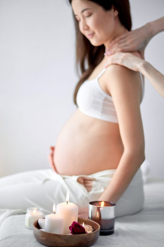A pregnant woman getting a prenatal massage