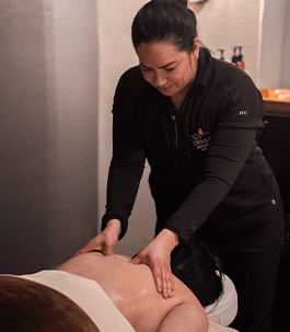 Deep tissue massage A therapist performing a deep tissue massage on a client's back