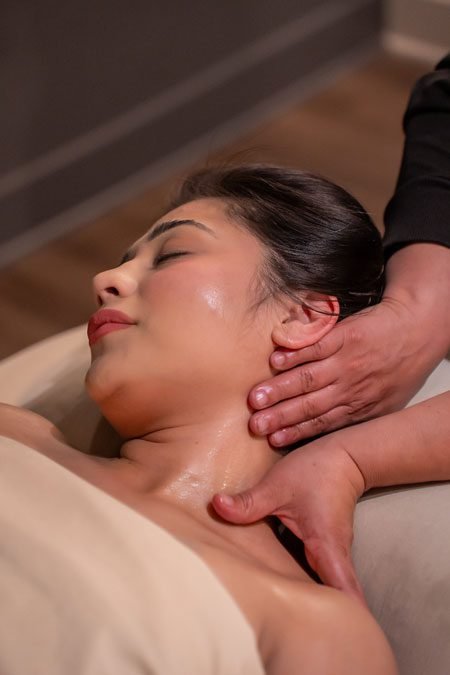 swedish-massage-page A woman receiving a relaxing neck and shoulder massage from a therapist