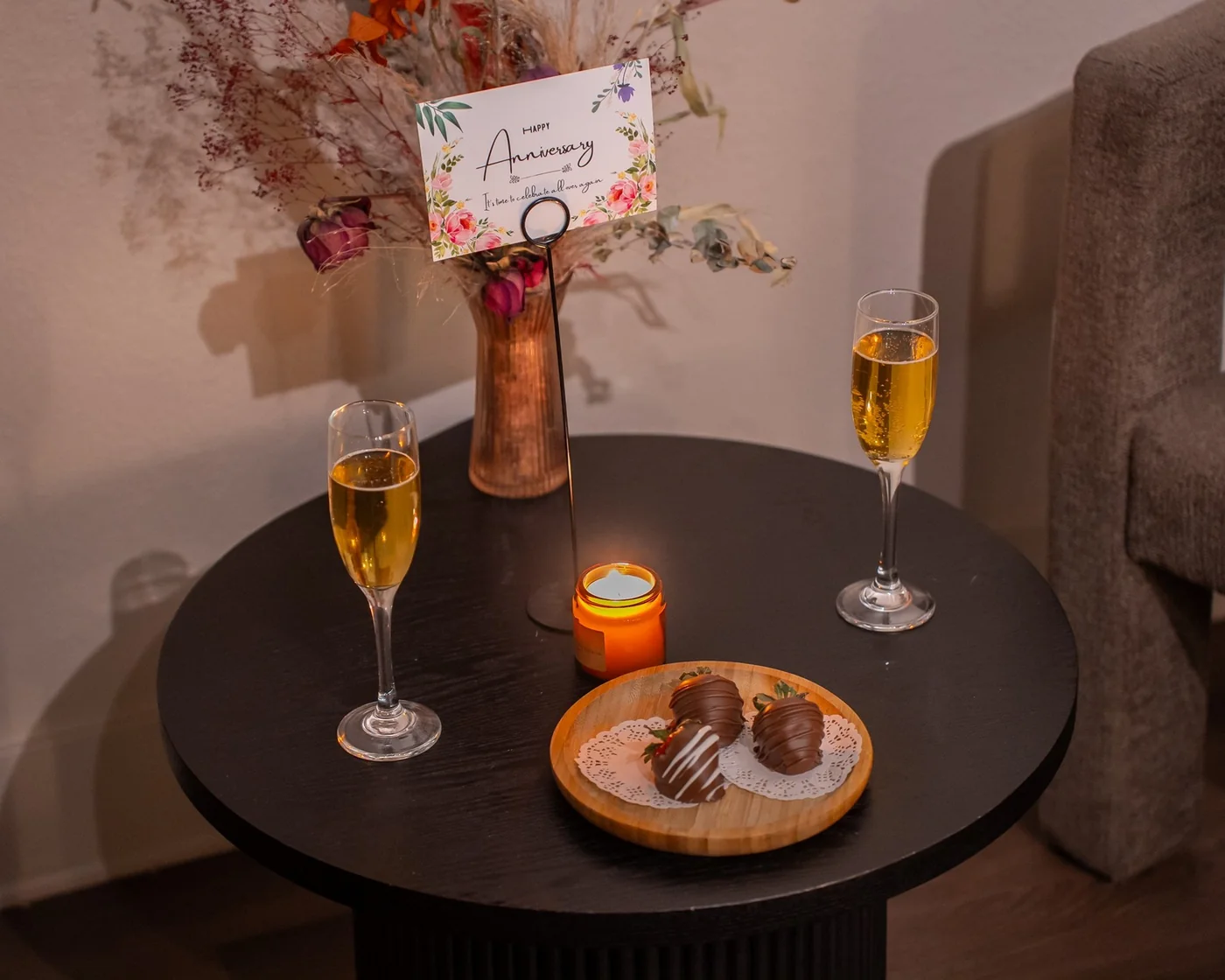 An anniversary card, beverages and chocolate-covered strawberries at Zen'd Out